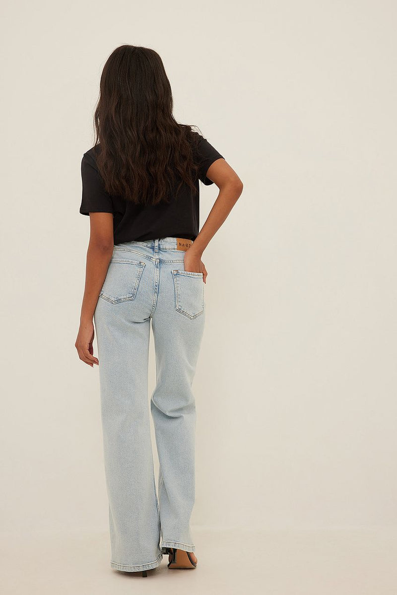 Relaxed Bootcut Fit Jeans with Wavy Dark Hair