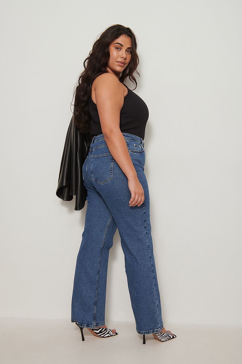 Relaxed fit, full-length recycled denim jeans on a fashionable model, showcasing the straight leg design.