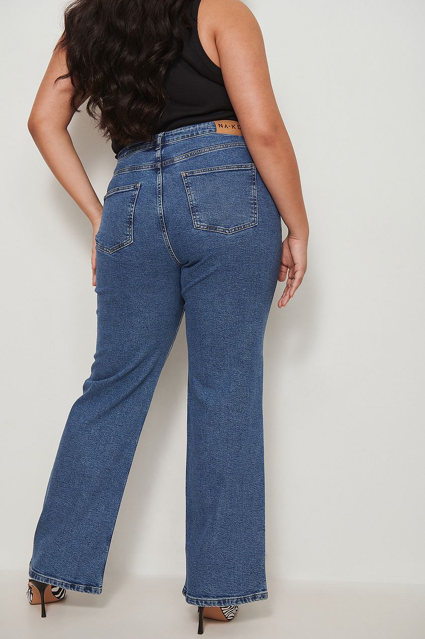 Relaxed fit recycled denim jeans with high-waisted design and straight leg silhouette.