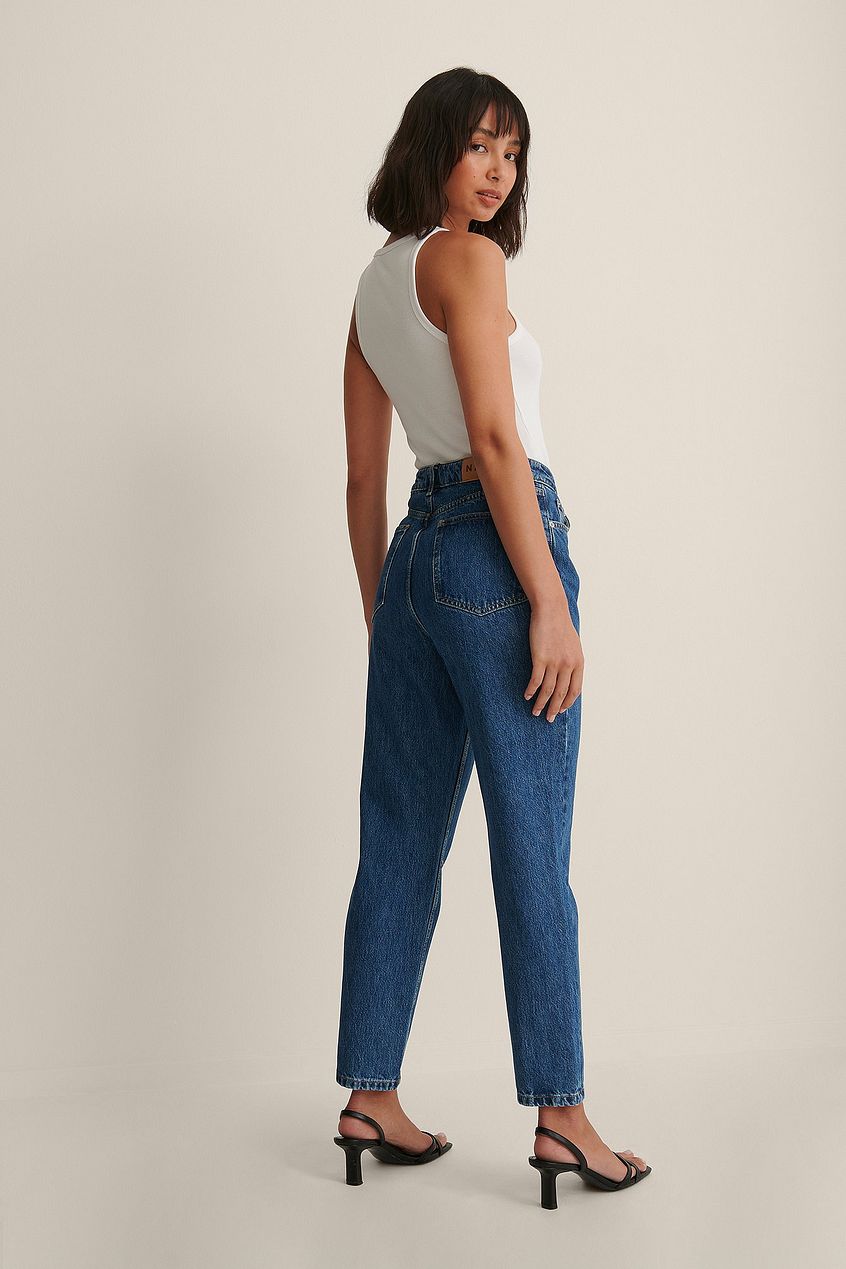 Rigid Mom Jeans - High-waisted denim jeans with a straight leg silhouette, worn by a young Asian woman with a neutral expression against a plain background.