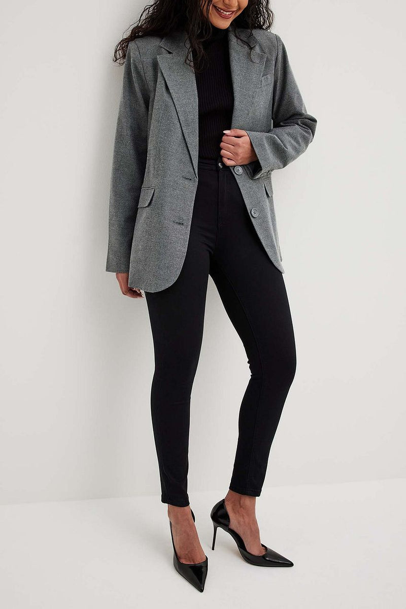 Stylish gray blazer and black slacks on female model, Ace Cart brand