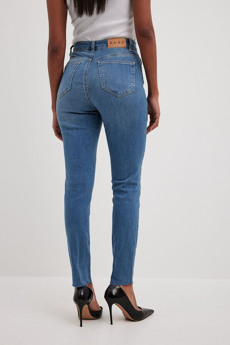 Skinny high-waist raw-hemmed denim jeans from Ace Cart in a modern and stylish design.