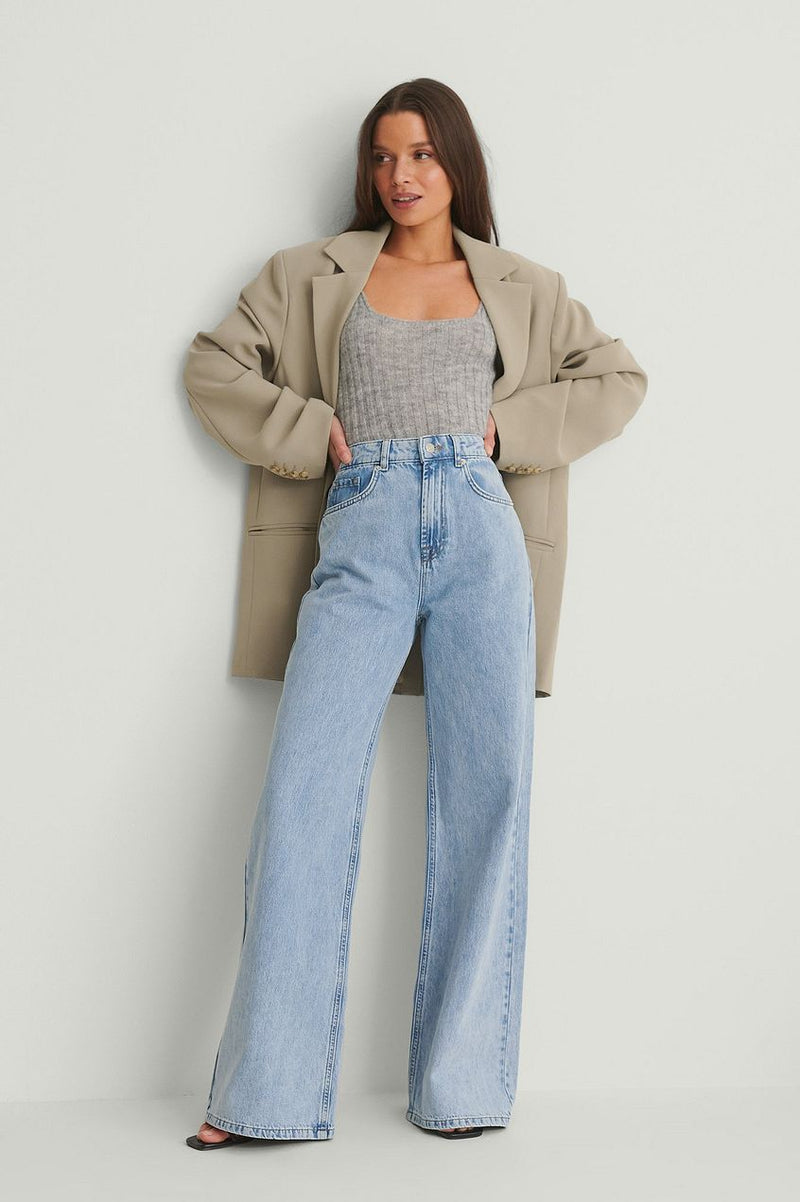Organic Soft Rigid Wide Jeans - High-waisted denim pants with relaxed fit and flared legs worn by young female model in casual outfit.