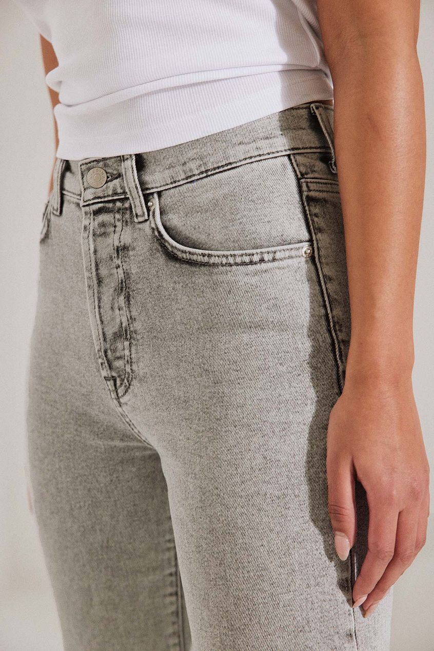 Organic Straight High Waist Jeans - Denim pants with a sleek, contemporary design showcased on a female model's lower body.
