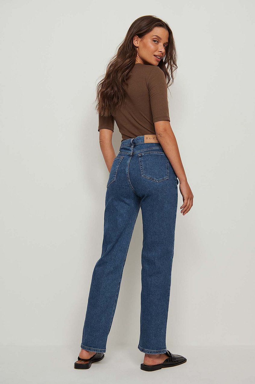 High-waist straight leg blue denim jeans, casual brown crop top, classic casual female fashion