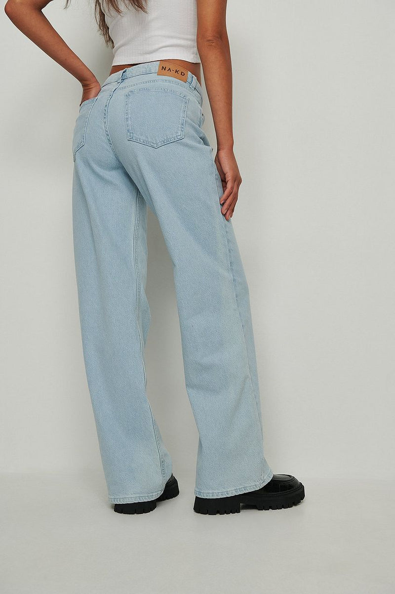 High-waist denim jeans with wide leg design by Ace Cart, showcasing a relaxed and trendy look.