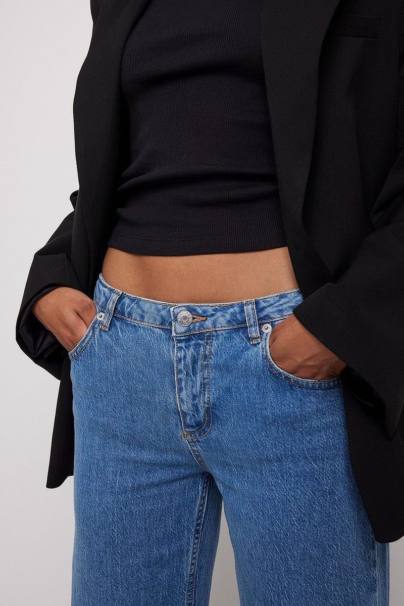 Super low waist blue denim jeans on female model, stylish casual clothing from Ace Cart brand.