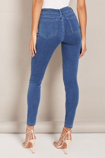 Stylish high-waisted blue jeggings with ripped knee detail, designed for a comfortable and fashionable fit.