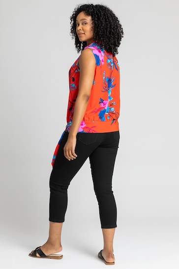 Vibrant floral print women's top, sleeveless crop style, black cropped pants, casual modern outfit for women.