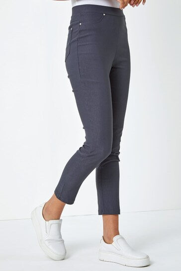 Sleek and stretchy high-waisted grey jeggings with a tapered leg, ideal for a comfortable yet stylish look.