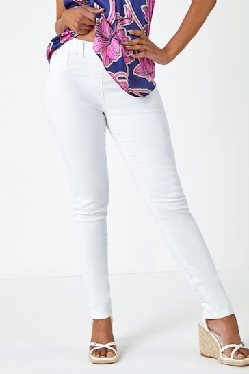 Stylish white stretch denim jeggings with a floral print top, ideal for a casual summer look from Ace Cart.