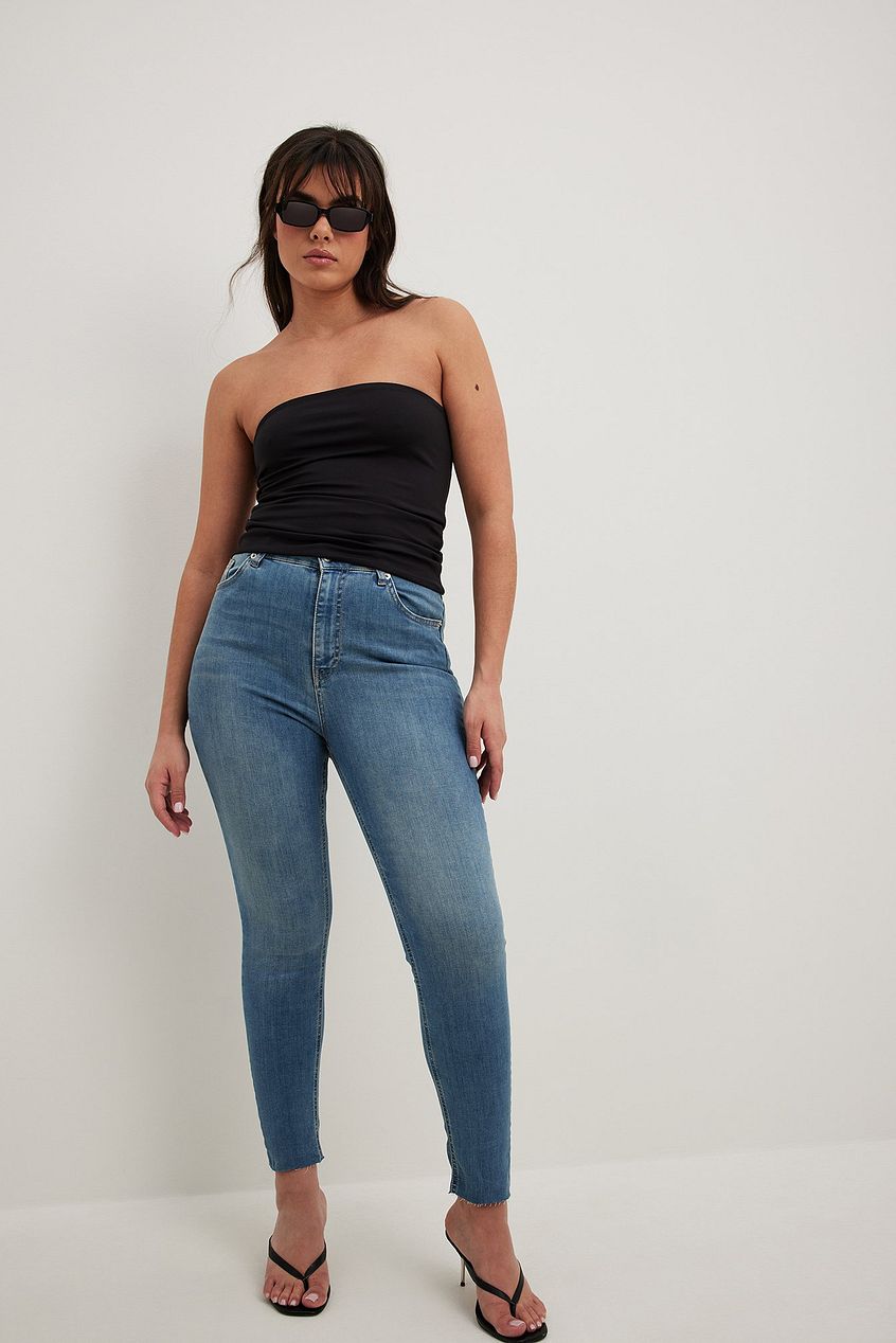 High-Waisted Skinny Denim Jeans, Strapless Black Top, Stylish Sunglasses